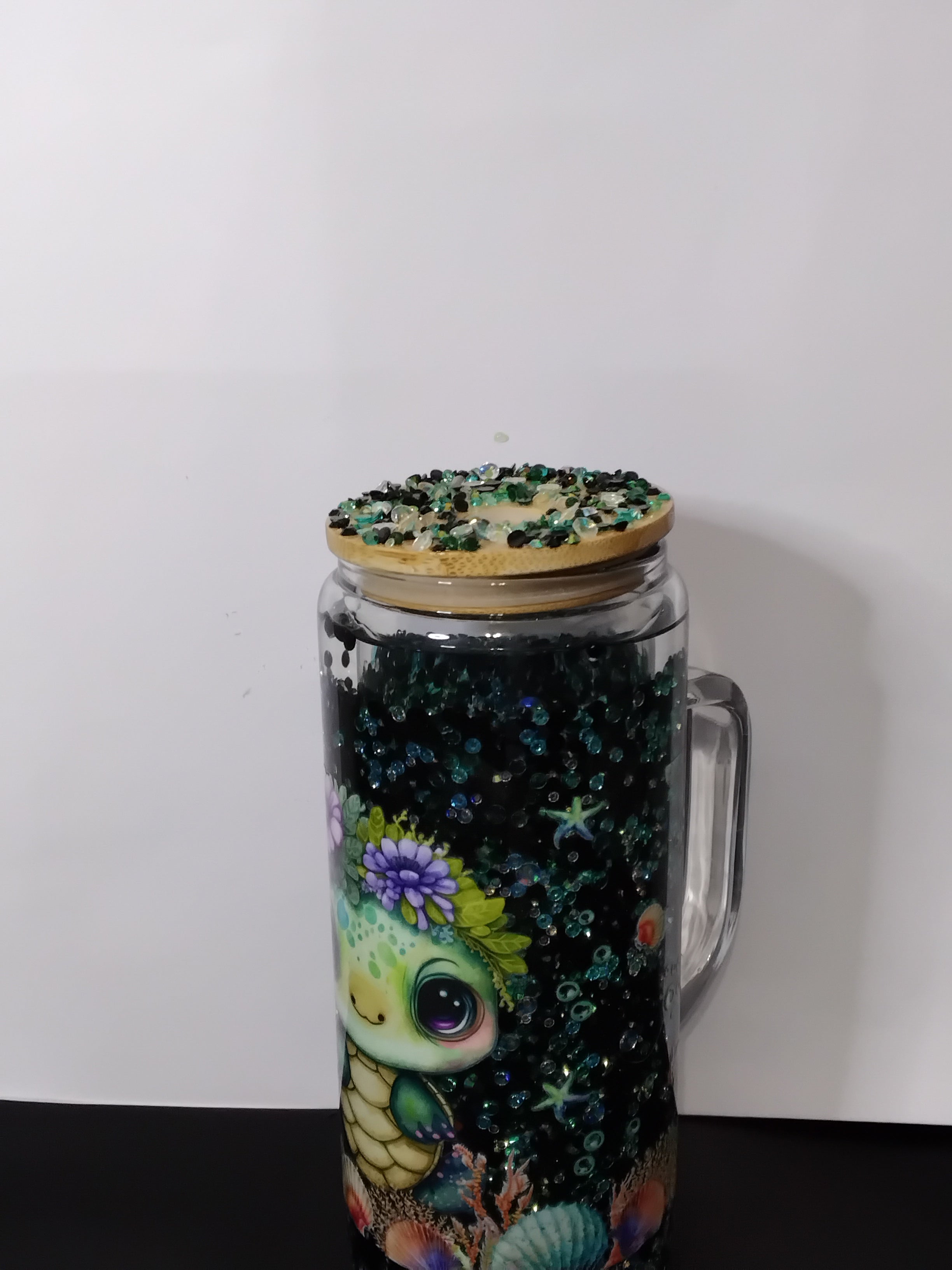 20 oz glass filled with rhinestones